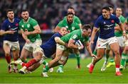 2 February 2024; Hugo Keenan of Ireland is tackled by Gael Fickou of France during the Guinness Six Nations Rugby Championship match between France and Ireland at the Stade Velodrome in Marseille, France. Photo by Ramsey Cardy/Sportsfile