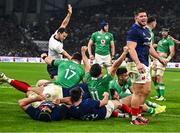2 February 2024; Ireland players including James Lowe, 11, celebrate as Rónan Kelleher, hidden, scores their side's fifth try during the Guinness Six Nations Rugby Championship match between France and Ireland at the Stade Velodrome in Marseille, France. Photo by Harry Murphy/Sportsfile