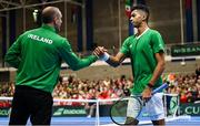 3 February 2024; Michael Agwi of Ireland with Team Ireland captain Conor Niland during his singles match on day one of the Davis Cup World Group I Play-off 1st Round match between Ireland and Austria at UL Sport Arena in Limerick. Photo by Brendan Moran/Sportsfile
