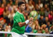 3 February 2024; Michael Agwi of Ireland celebrates winning a point against Dominic Thiem of Austria during their singles match on day one of the Davis Cup World Group I Play-off 1st Round match between Ireland and Austria at UL Sport Arena in Limerick. Photo by Brendan Moran/Sportsfile