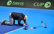 2 February 2024; Staff prepare the court before an Ireland Tennis squad training session at the UL Sport Arena in Limerick, ahead of Ireland's Davis Cup World Group One play-off first round match with Austria. Photo by Brendan Moran/Sportsfile