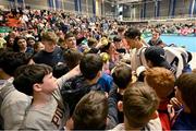 3 February 2024; Dominic Thiem of Austria signs autographs for young fans after his match against Michael Agwi of Ireland on day one of the Davis Cup World Group I Play-off 1st Round match between Ireland and Austria at UL Sport Arena in Limerick. Photo by Brendan Moran/Sportsfile