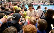 3 February 2024; Dominic Thiem of Austria signs autographs for young fans after his match against Michael Agwi of Ireland on day one of the Davis Cup World Group I Play-off 1st Round match between Ireland and Austria at UL Sport Arena in Limerick. Photo by Brendan Moran/Sportsfile