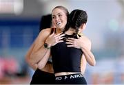 3 February 2024; Jessica Tappin of Clonliffe Harriers AC, Dublin, with Katie Elliot of Letterkenny AC, Galway, right, after competing in the Women's 60m Hurdles during the AAI National Indoor League Final at the TUS Indoor Arena, Athlone in Westmeath. Photo by Ben McShane/Sportsfile