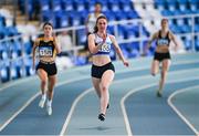 3 February 2024; Katie Doherty of Ratoath AC, Dublin, on her way to winning the Women's 200m during the AAI National Indoor League Final at the TUS Indoor Arena, Athlone in Westmeath. Photo by Ben McShane/Sportsfile