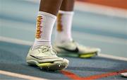 3 February 2024; A detailed view of the socks and spikes of Fatima Amasun of Leevale AC, Cork, before competing in the Women's 200m during the AAI National Indoor League Final at the TUS Indoor Arena, Athlone in Westmeath. Photo by Ben McShane/Sportsfile