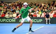 3 February 2024; Osgar Ó hOisín of Ireland in action against Sebastian Ofner of Austria during their singles match on day one of the Davis Cup World Group I Play-off 1st Round match between Ireland and Austria at UL Sport Arena in Limerick. Photo by Brendan Moran/Sportsfile