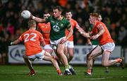 3 February 2024; Ronan Jones of Meath in action against Armagh players, from left, Cian McConville, Greg McCabe and Ciaran Mackin during the Allianz Football League Division 2 match between Armagh and Meath at BOX-IT Athletic Grounds in Armagh. Photo by Ben McShane/Sportsfile