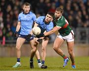 3 February 2024; Theo Clancy of Dublin is tackled by Aidan O'Shea of Mayo during the Allianz Football League Division 1 match between Mayo and Dublin at Hastings Insurance MacHale Park in Castlebar, Mayo. Photo by Stephen McCarthy/Sportsfile