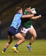 3 February 2024; Fergal Boland of Mayo in action against Greg McEneaney of Dublin during the Allianz Football League Division 1 match between Mayo and Dublin at Hastings Insurance MacHale Park in Castlebar, Mayo. Photo by Stephen McCarthy/Sportsfile