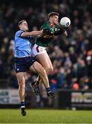 3 February 2024; Brian Fenton of Dublin in action against Jordan Flynn of Mayo during the Allianz Football League Division 1 match between Mayo and Dublin at Hastings Insurance MacHale Park in Castlebar, Mayo. Photo by Stephen McCarthy/Sportsfile