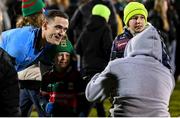 3 February 2024; Brian Fenton of Dublin poses for a photograph with a young Mayo supporters after the final whistle of the Allianz Football League Division 1 match between Mayo and Dublin at Hastings Insurance MacHale Park in Castlebar, Mayo. Photo by Stephen McCarthy/Sportsfile