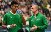 3 February 2024; Michael Agwi of Ireland, left, with Team Ireland captain Conor Niland during his singles match on day one of the Davis Cup World Group I Play-off 1st Round match between Ireland and Austria at UL Sport Arena in Limerick. Photo by Brendan Moran/Sportsfile