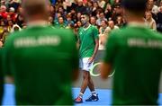 3 February 2024; Michael Agwi of Ireland is applauded by his teammates during their singles match against Dominic Thiem of Austria on day one of the Davis Cup World Group I Play-off 1st Round match between Ireland and Austria at UL Sport Arena in Limerick. Photo by Brendan Moran/Sportsfile