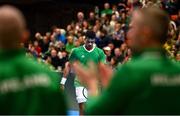 3 February 2024; Michael Agwi of Ireland is applauded by his teammates during their singles match against Dominic Thiem of Austria on day one of the Davis Cup World Group I Play-off 1st Round match between Ireland and Austria at UL Sport Arena in Limerick. Photo by Brendan Moran/Sportsfile
