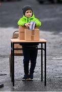 4 February 2024; Programme seller Liam Dowling, age 9, from Drogheda, takes his position before the Allianz Football League Division 2 match between Louth and Cork at DEFY Páirc Mhuire in Ardee, Louth. Photo by Ben McShane/Sportsfile