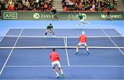 4 February 2024; David O'Hare, top left, and Conor Gannon of Ireland in action against Alexander Erler and Lucas Miedler of Austria during their doubles match on day two of the Davis Cup World Group I Play-off 1st Round match between Ireland and Austria at UL Sport Arena in Limerick. Photo by Brendan Moran/Sportsfile