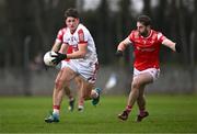 4 February 2024; Colm O'Callaghan of Cork in action against Dermot Campbell of Louth during the Allianz Football League Division 2 match between Louth and Cork at DEFY Páirc Mhuire in Ardee, Louth. Photo by Ben McShane/Sportsfile