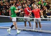 4 February 2024; David O'Hare of Ireland shakes hands with Alexander Erler and Lucas Miedler of Austria after their doubles match on day two of the Davis Cup World Group I Play-off 1st Round match between Ireland and Austria at UL Sport Arena in Limerick. Photo by Brendan Moran/Sportsfile