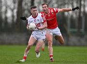 4 February 2024; Luke Fahy of Cork in action against Conor Grimes of Louth during the Allianz Football League Division 2 match between Louth and Cork at DEFY Páirc Mhuire in Ardee, Louth. Photo by Ben McShane/Sportsfile
