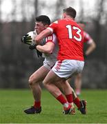 4 February 2024; Mark Cronin of Cork is tackled by Ryan Burns of Louth during the Allianz Football League Division 2 match between Louth and Cork at DEFY Páirc Mhuire in Ardee, Louth. Photo by Ben McShane/Sportsfile