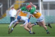 4 February 2024; Kieran Bennett of Waterford is tackled by Charlie Mitchell, right, and Brian Duignan during the Allianz Hurling League Division 1 Group A match between Offaly and Waterford at Glenisk O'Connor Park in Tullamore, Offaly. Photo by Tyler Miller/Sportsfile