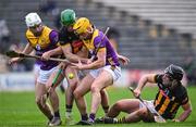 4 February 2024; Eoin Cody of Kilkenny, suppported by team-mate Harry Shine, right, in action against Wexford players Niall Murphy, left, and Damien Reck during the Allianz Hurling League Division 1 Group A match between Kilkenny and Wexford at UPMC Nowlan Park in Kilkenny. Photo by Piaras Ó Mídheach/Sportsfile
