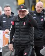 4 February 2024; Derry manager Mickey Harte puts on his cap after it blowing off in the wind on his arrival to the Allianz Football League Division 1 match between Derry and Tyrone at Celtic Park in Derry. Photo by Ramsey Cardy/Sportsfile