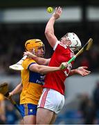 4 February 2024; Tommy O'Connell of Cork is tackled by Robin Mounsey of Clare during the Allianz Hurling League Division 1 Group A match between Clare and Cork at Cusack Park in Ennis, Clare. Photo by Ray McManus/Sportsfile