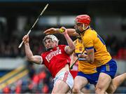 4 February 2024; Tommy O'Connell of Cork is tackled by Peter Duggan of Clare during the Allianz Hurling League Division 1 Group A match between Clare and Cork at Cusack Park in Ennis, Clare. Photo by Ray McManus/Sportsfile