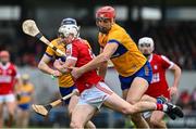 4 February 2024; Tommy O'Connell of Cork is tackled by Peter Duggan of Clare during the Allianz Hurling League Division 1 Group A match between Clare and Cork at Cusack Park in Ennis, Clare. Photo by Ray McManus/Sportsfile