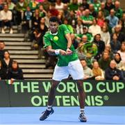 4 February 2024; Michael Agwi of Ireland in action against Lucas Miedler of Austria during their singles match on day two of the Davis Cup World Group I Play-off 1st Round match between Ireland and Austria at UL Sport Arena in Limerick. Photo by Brendan Moran/Sportsfile