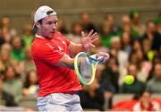 4 February 2024; Lucas Miedler of Austria in action against Michael Agwi of Ireland during their singles match on day two of the Davis Cup World Group I Play-off 1st Round match between Ireland and Austria at UL Sport Arena in Limerick. Photo by Brendan Moran/Sportsfile
