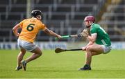 4 February 2024; Shane O'Brien of Limerick is tackled by Ryan McGarry of Antrim during the Allianz Hurling League Division 1 Group B match between Limerick and Antrim at FBD Semple Stadium in Thurles, Tipperary. Photo by Tom Beary/Sportsfile
