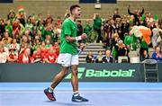 4 February 2024; Michael Agwi of Ireland celebrates winning a point against Lucas Miedler of Austria during their singles match on day two of the Davis Cup World Group I Play-off 1st Round match between Ireland and Austria at UL Sport Arena in Limerick. Photo by Brendan Moran/Sportsfile
