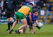 4 February 2024; Ciarán Brady of Cavan is tackled by Dáire O'Baoill of Donegal during the Allianz Football League Division 2 match between Cavan and Donegal at Kingspan Breffni in Cavan. Photo by Stephen McCarthy/Sportsfile