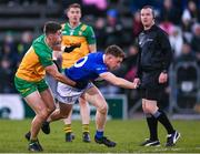 4 February 2024; Ciarán Brady of Cavan is tackled by Dáire O'Baoill of Donegal during the Allianz Football League Division 2 match between Cavan and Donegal at Kingspan Breffni in Cavan. Photo by Stephen McCarthy/Sportsfile