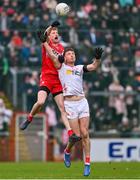 4 February 2024; Brendan Rogers of Derry in action against Brian Kennedy of Tyrone during the Allianz Football League Division 1 match between Derry and Tyrone at Celtic Park in Derry. Photo by Ramsey Cardy/Sportsfile