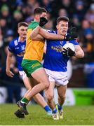 4 February 2024; Dara McVeety of Cavan is tackled by Dáire O'Baoill of Donegal during the Allianz Football League Division 2 match between Cavan and Donegal at Kingspan Breffni in Cavan. Photo by Stephen McCarthy/Sportsfile