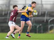 4 February 2024; Niall Daly of Roscommon in action against Cillian Ó Curraoin of Galway during the Allianz Football League Division 1 match between Roscommon and Galway at Dr Hyde Park in Roscommon. Photo by Daire Brennan/Sportsfile