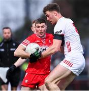4 February 2024; Ciaran McFaul of Derry in action against Brian Kennedy of Tyrone during the Allianz Football League Division 1 match between Derry and Tyrone at Celtic Park in Derry. Photo by Ramsey Cardy/Sportsfile