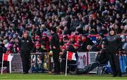 4 February 2024; Derry manager Mickey Harte, right, and Tyrone joint-manager Brian Dooher during the Allianz Football League Division 1 match between Derry and Tyrone at Celtic Park in Derry. Photo by Ramsey Cardy/Sportsfile