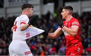4 February 2024; Aidan Clarke of Tyrone and Conor Doherty of Derry tussle during the Allianz Football League Division 1 match between Derry and Tyrone at Celtic Park in Derry. Photo by Ramsey Cardy/Sportsfile
