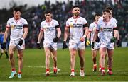 4 February 2024; Tyrone players, from left, Conall Devlin, Ciarán Daly, Padraig Hampsey and Ruairi Canavan leave the pitch at half-time of the Allianz Football League Division 1 match between Derry and Tyrone at Celtic Park in Derry. Photo by Ramsey Cardy/Sportsfile