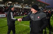 4 February 2024; Derry manager Mickey Harte, right, and Matthew Donnelly of Tyrone shane hands after the Allianz Football League Division 1 match between Derry and Tyrone at Celtic Park in Derry. Photo by Ramsey Cardy/Sportsfile