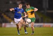 4 February 2024; Jeaic Mac Ceallabhui of Donegal in action against Killian Clarke of Cavan during the Allianz Football League Division 2 match between Cavan and Donegal at Kingspan Breffni in Cavan. Photo by Stephen McCarthy/Sportsfile