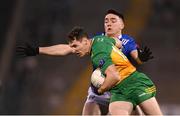 4 February 2024; Jamie Brennan of Donegal is tackled by Niall Carolan of Cavan during the Allianz Football League Division 2 match between Cavan and Donegal at Kingspan Breffni in Cavan. Photo by Stephen McCarthy/Sportsfile