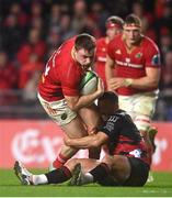 3 February 2024; Seán O'Brien of Munster is tackled by Ryan Crotty of Crusaders during the international rugby friendly match between Munster and Crusaders at SuperValu Páirc Uí Chaoimh in Cork. Photo by Sam Barnes/Sportsfile