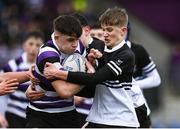 6 February 2024; Niall Fallon of Terenure College is tackled by Mark Travers of Newbridge College during the Bank of Ireland Leinster Schools Junior Cup Round 1 match between Newbridge College and Terenure College at Energia Park in Dublin. Photo by Harry Murphy/Sportsfile