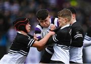 6 February 2024; Niall Fallon of Terenure College is tackled by Eoghan Hearne, left, and Mark Travers of Newbridge College during the Bank of Ireland Leinster Schools Junior Cup Round 1 match between Newbridge College and Terenure College at Energia Park in Dublin. Photo by Harry Murphy/Sportsfile